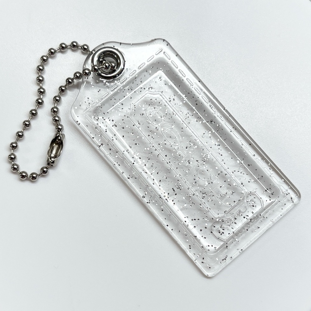 Coach Poppy Clear Glitter Hang Tag 1 1/2 inches wide EUC